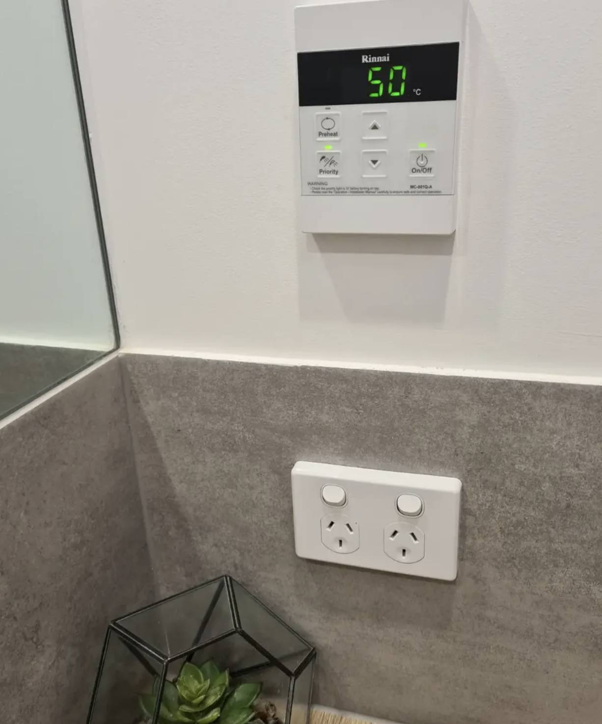 Rinnai hot water temperature controller shown on Grove’s hot water service page