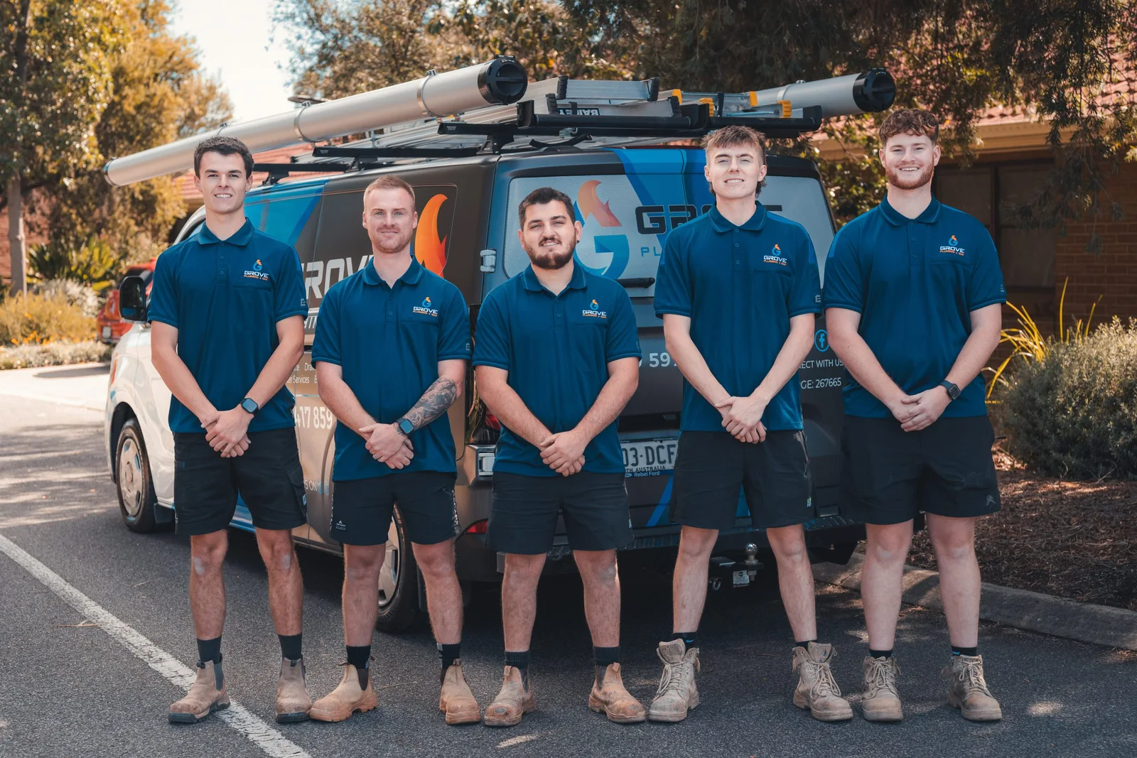 Grove Plumbing and Gas team in front of their van
